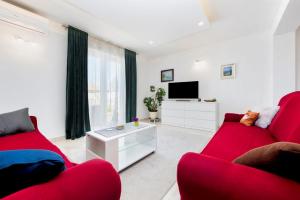 TV a/nebo společenská místnost v ubytování Holiday Home Fradelani