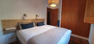 מיטה או מיטות בחדר ב-Finca Casa Emilia