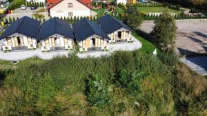an aerial view of a house with a roof at Domki Marcus in Rowy