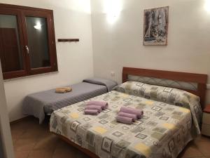 Postel nebo postele na pokoji v ubytování Veliero House