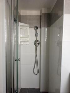a shower with a shower head in a bathroom at Ofir, nice small unit, 123Eilat in Eilat