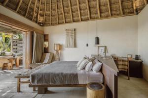 Postel nebo postele na pokoji v ubytování Hotel Ma'xanab Tulum
