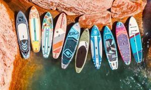 a row of surfboards lined up against a wall at Walking Distance To Beach And Shops in New Buffalo
