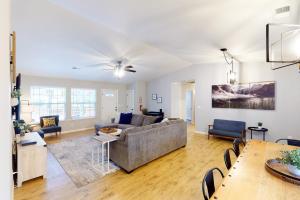 a living room with a couch and a table at Pine Place in Oakhurst