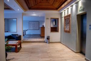 a hallway with a living room and a living room at Hotel Qualitel Centro Histórico in Morelia