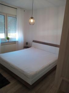 Postel nebo postele na pokoji v ubytování 5 Sterne Ferienwohnung Dünensand