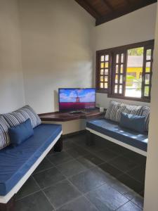 TV tai viihdekeskus majoituspaikassa Camburi Chalés