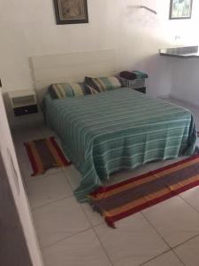 En eller flere senge i et værelse på Belo Recanto