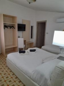 Ένα ή περισσότερα κρεβάτια σε δωμάτιο στο B&B Camera & Caffe