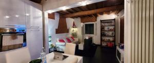 a small living room with a couch and a table at Mirko Design Apartment in Prato