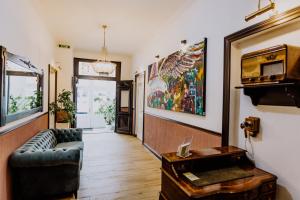a living room with a couch and a table at Hotel Villa Ems in Borkum