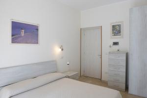 Letto o letti in una camera di B&B I Gerani