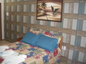 Ένα ή περισσότερα κρεβάτια σε δωμάτιο στο Pousada Ricardinho do Frances