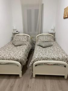 Postel nebo postele na pokoji v ubytování Ca' ToscaLina