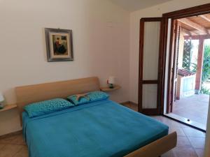 En eller flere senge i et værelse på casa vacanza mika