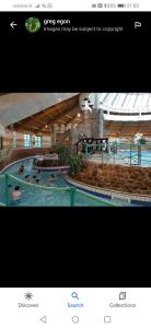 uma foto de uma piscina com pessoas nela em Home Comforts em Castleisland