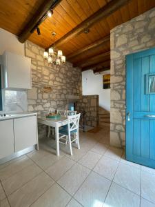 Kuchyň nebo kuchyňský kout v ubytování Petra Nova Villas