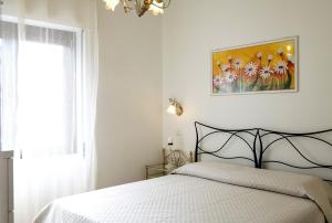 Letto o letti in una camera di B&B I Gerani