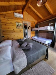 a bedroom with two bunk beds in a cabin at House Tina in Grabovac