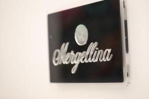 a sign for a store with the word electricity at Mecla Suites in Naples +62 photos