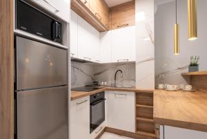 Η κουζίνα ή μικρή κουζίνα στο Apartament w Centrum Ciechocinka