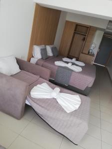 Katil atau katil-katil dalam bilik di JOY Hotel Apts