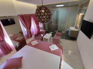 a bedroom with a large bed and a bathroom at Villa Vista Real in Kotor