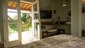 Μια τηλεόραση ή/και κέντρο ψυχαγωγίας στο POUSADA LA BELLE D'JOUR - PIPA/RN