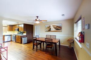 a kitchen and dining room with a table and chairs at Calandri Lakeview House in Bass Lake