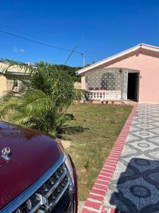 a car parked in front of a house at Peaceful 1-bedroom 1bath, WIFI, Air Conditioning in Montego Bay