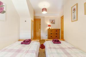 Katil atau katil-katil dalam bilik di Rose Cottage