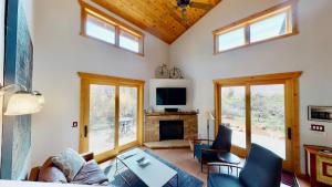 a living room with a couch and a fireplace at Rim View Retreat #14 in Moab