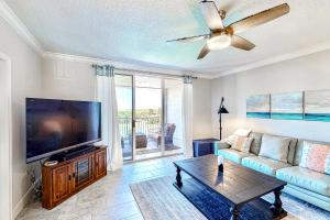 a living room with a large flat screen tv at Shorewood in Cape Canaveral