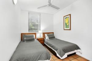 Ένα ή περισσότερα κρεβάτια σε δωμάτιο στο Yiningie Apartment Baden 9 Rainbow Shores +11 φωτογραφίες