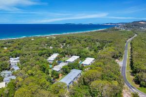 an aerial view of a house and the ocean at Baden 70 Rainbow Shores in Rainbow Beach