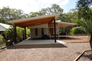 a small house with a pavilion in a yard at 15 Esprit Drive Rainbow Shores in Rainbow Beach