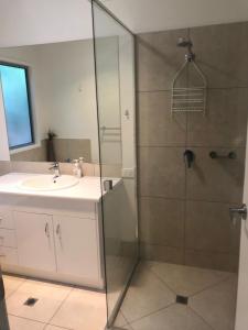 a bathroom with a shower and a sink at 15 Esprit Drive Rainbow Shores in Rainbow Beach