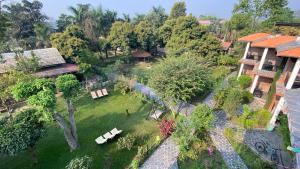 an overhead view of a yard with benches and a house at Chautari Garden Resort in Sauraha
