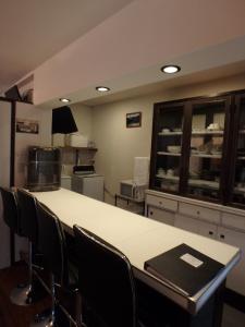 a kitchen with a table and chairs in a room at Kyo No Yado Nishioji inn in Kyoto