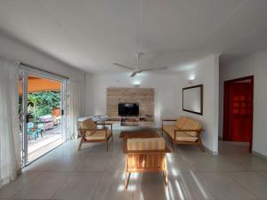 a living room with a couch and a table at Beau Vallon Villa Self Catering With Pool in Beau Vallon