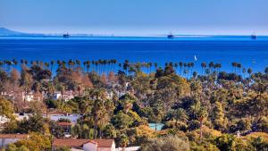an aerial view of a town with palm trees and the ocean at Kimpton Canary Hotel by IHG in Santa Barbara