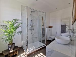 a bathroom with a glass shower and a toilet at Le Petit Chateau in Châteauneuf-de-Gadagne +77 photos