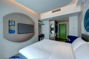 ibis Styles Johor Iskandar Puteri客房内的一张或多张床位