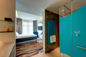 ibis Styles Johor Iskandar Puteri客房内的一张或多张床位