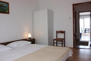 Postel nebo postele na pokoji v ubytování Apartment E&M