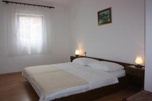 Postel nebo postele na pokoji v ubytování Apartment E&M