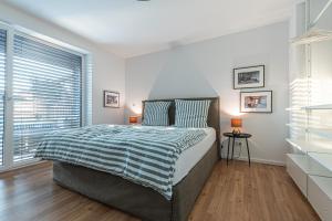 Tempat tidur dalam kamar di B26 Apartments - Unterwegs zu Hause