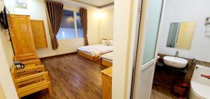 Giường trong phòng chung tại DALAMOON HOTEL
