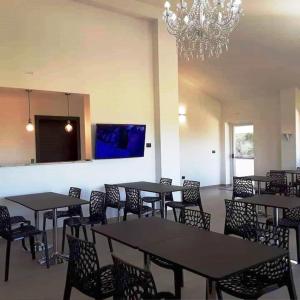 TV a/nebo společenská místnost v ubytování Elios Rooms