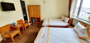 Giường trong phòng chung tại DALAMOON HOTEL